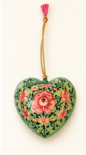 Hand-painted papier mache heart ornament in green with pink flowers and pink tassel