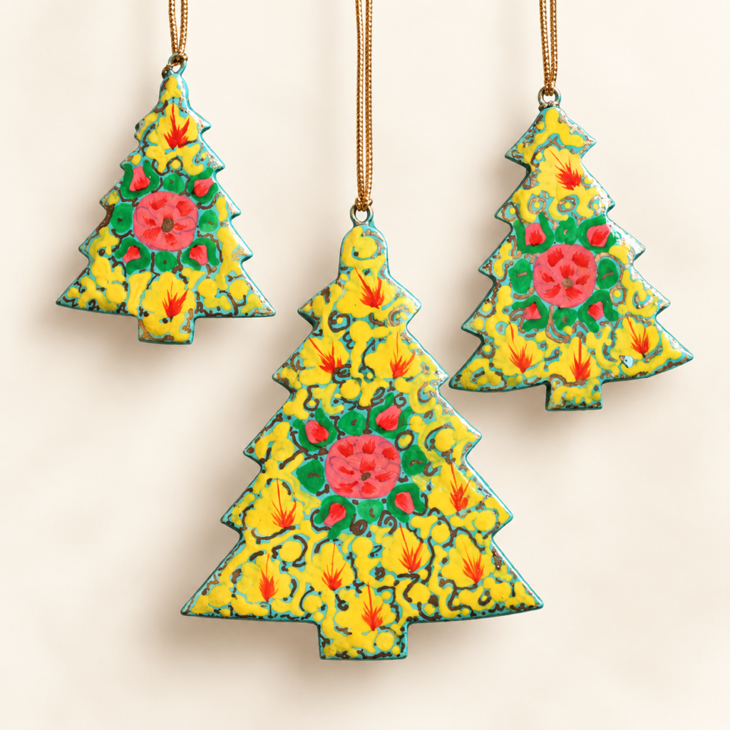 Yellow papier mache tree ornaments hand-painted in Kashmir with pink flowers on sunny yellow with a teal border