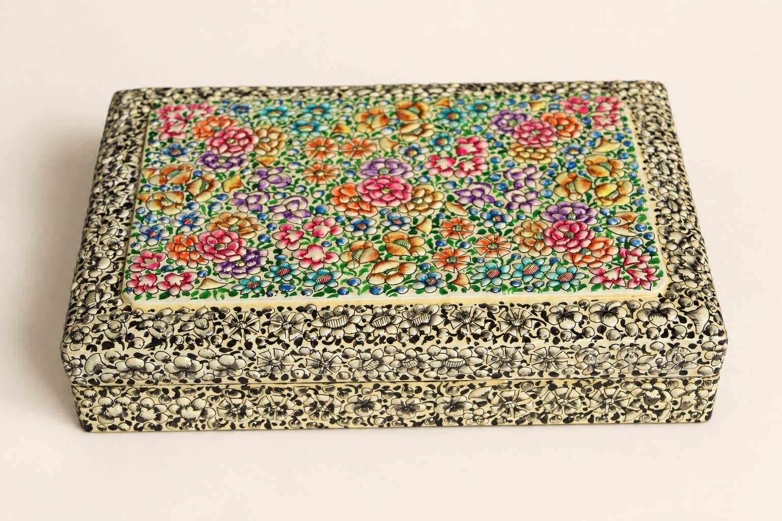 Green floral paper mache box from Kashmir, angled view