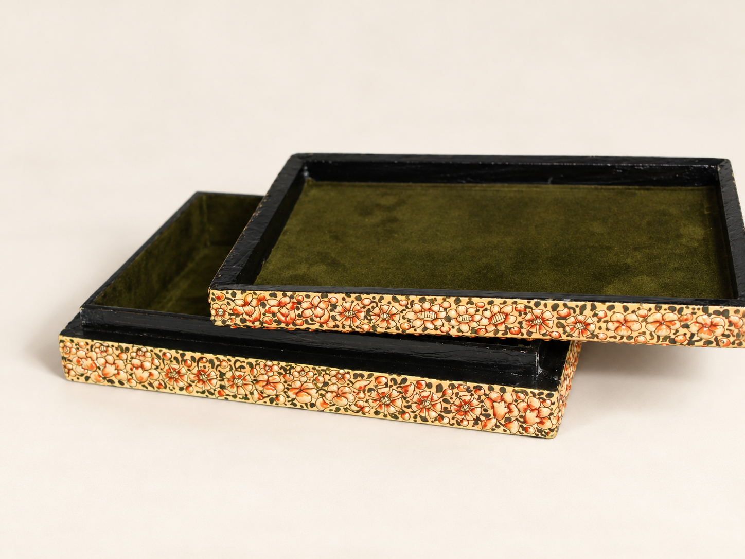 Orange floral paper mache keepsake box with the lid lifted to show the olive green lining