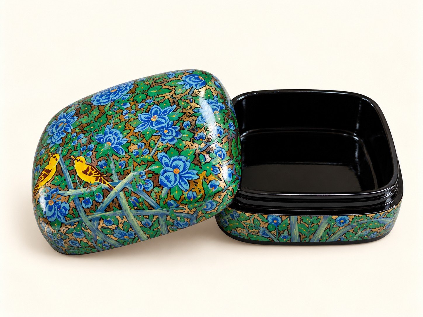 Open blue blossom papier mache box with yellow birds on the lid and glossy black lacquered interior