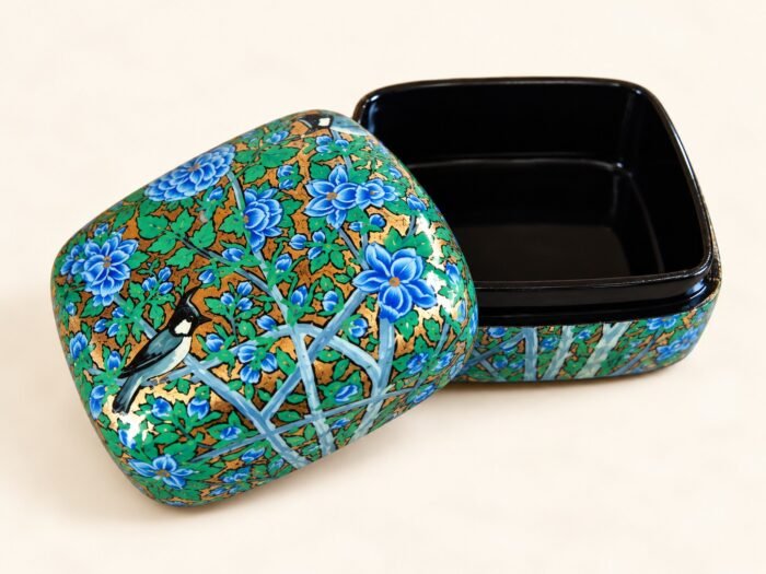 Blue floral papier mache box hand-painted with blue blossoms, green leaves and a songbird on gold, small Kashmiri jewelry box with black lacquer interior