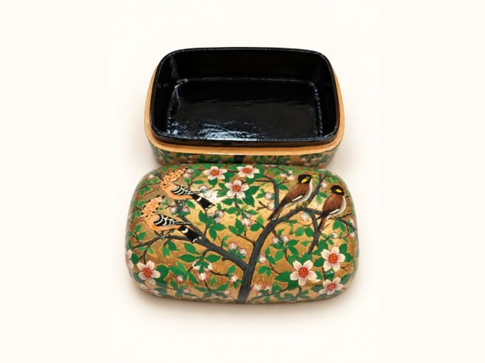 Open 7x4 inch papier mache box hand-painted with brown finches on flowering branches and white blossoms on gold and green, glossy black lacquered interior