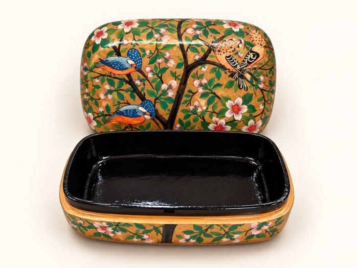 Open golden branch papier mache box hand-painted with a blue kingfisher and flowering branches with white and pink blossoms on gold and green, glossy black lacquered interior