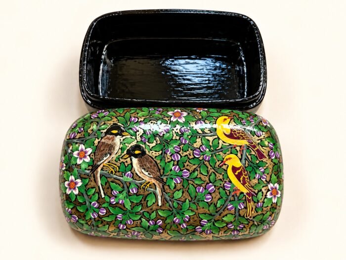 Open 7x4 inch papier mache box hand-painted with grey songbirds and yellow birds among purple blossoms on green, glossy black lacquered interior