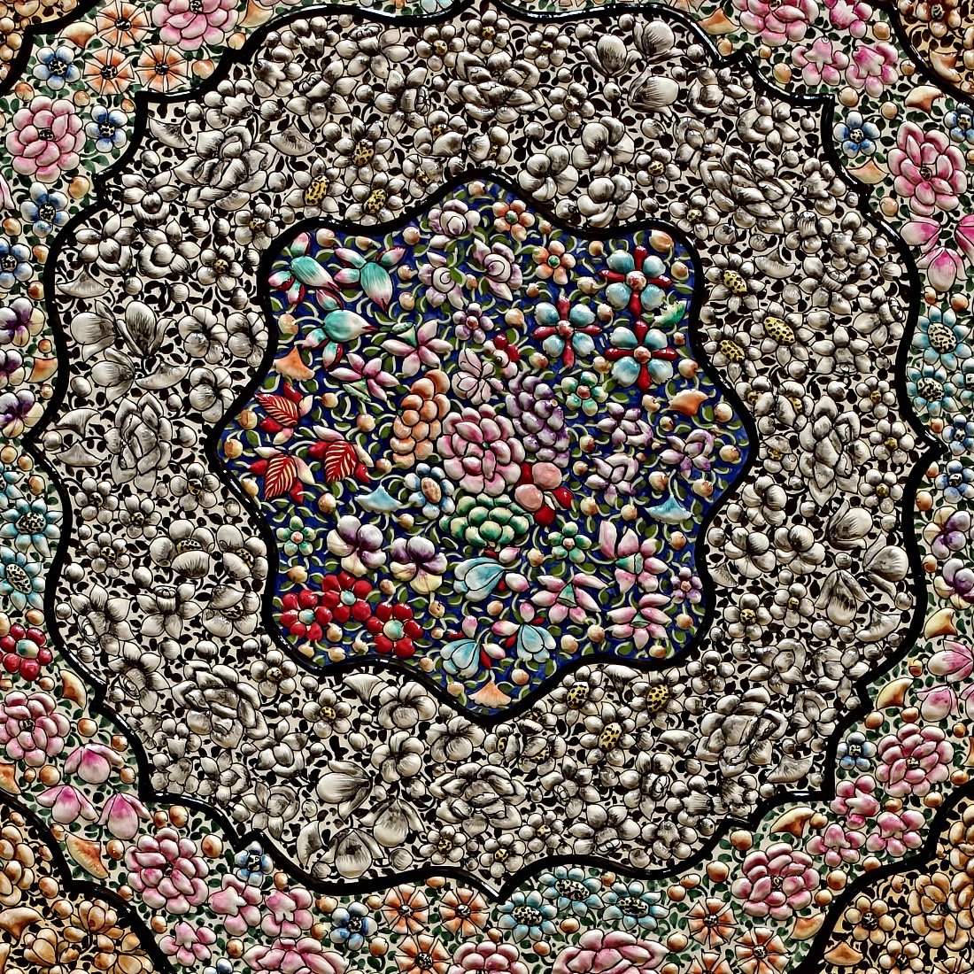 Close-up of the centre medallion with embossed silver petals