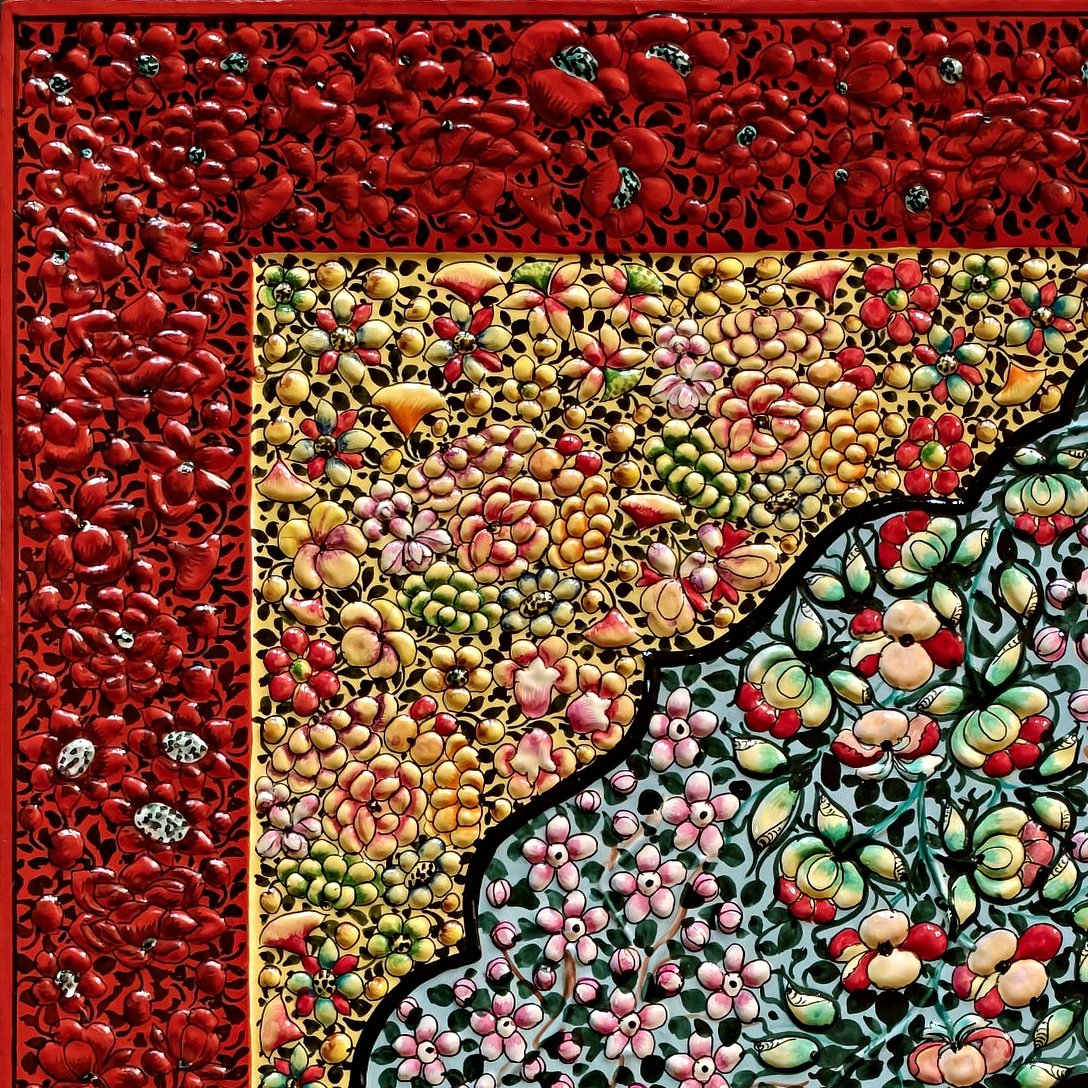 Corner detail with red embossed border and golden floral corner