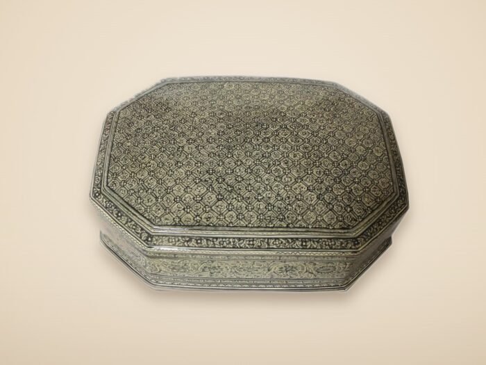 Hand-painted Kashmiri paper mache art in a paisley Mughal design, style 5, on a warm studio background
