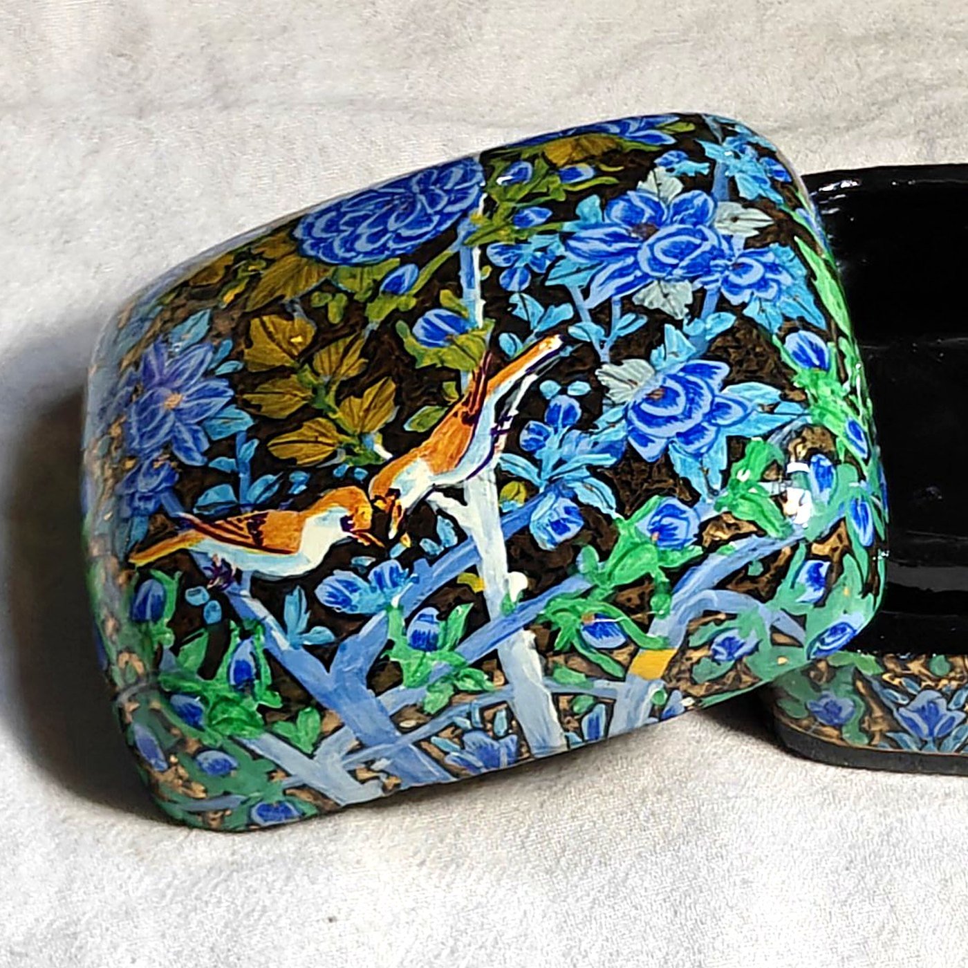 Blue papier mache ring box, Blue Garden No. 1, hand-painted with a songbird feeding its mate and real 24K gold strokes, lid resting against the open box