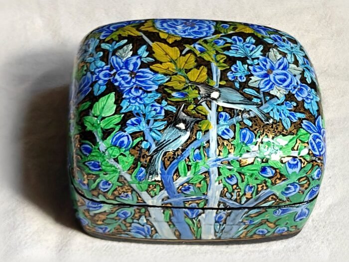 Small papier mache jewelry box, Blue Garden No. 5, hand-painted with a bulbul swooping toward its mate and real 24K gold strokes, with the lid on