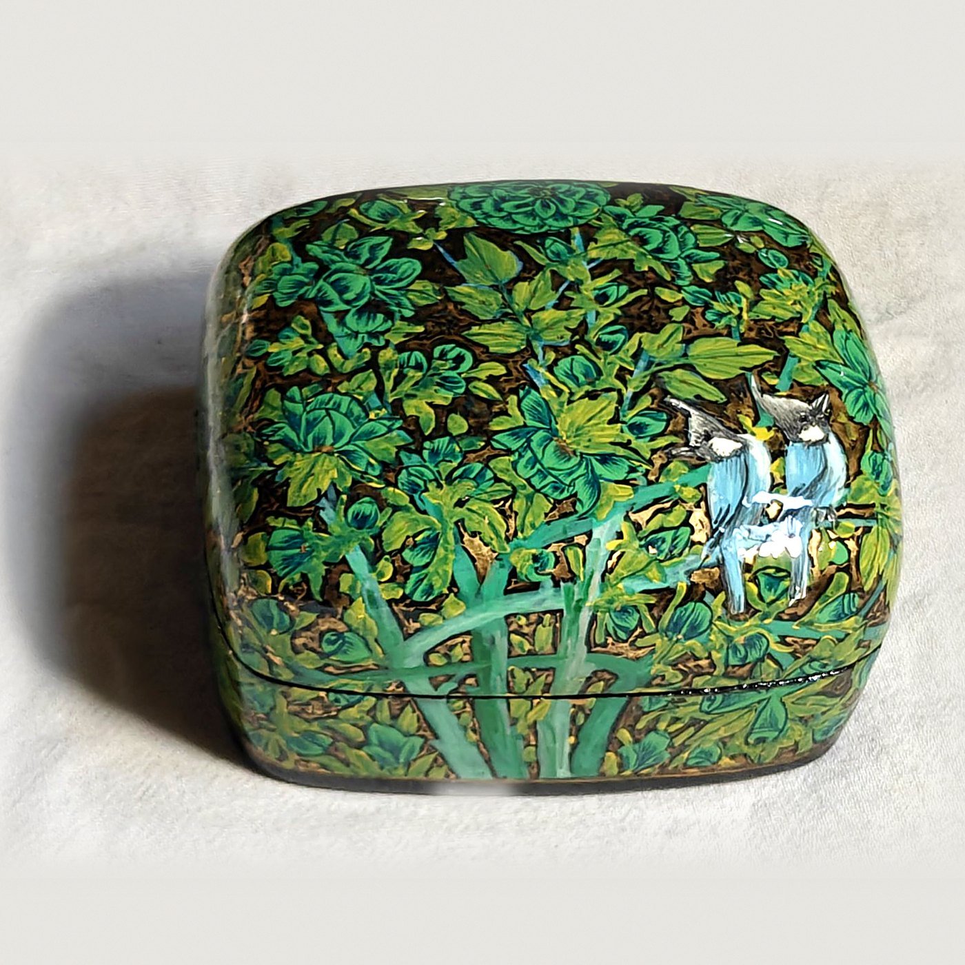 Emerald green papier mache box, Emerald Garden No. 2, hand-painted with a pair of crested bulbuls and real 24K gold strokes, with the lid on