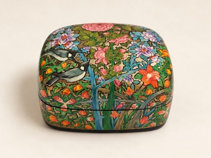 Closed pink peony papier mache box hand-painted with pink and orange flowers and a blue bird on green foliage, small Kashmiri jewelry box