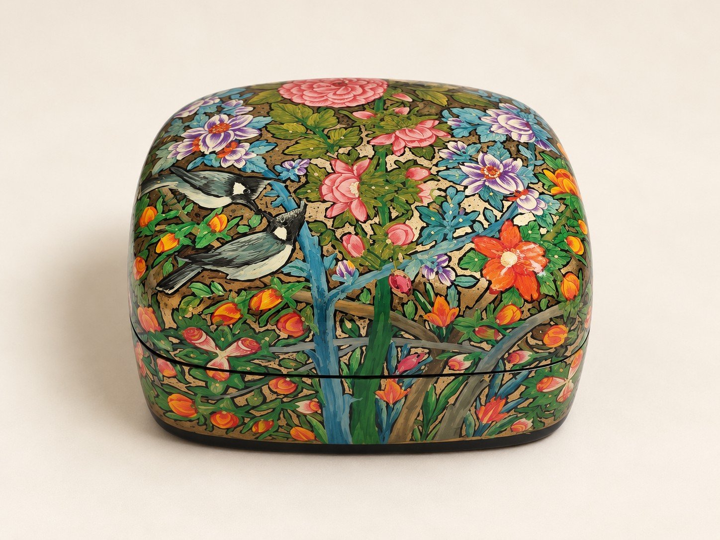 Closed pink peony papier mache box hand-painted with pink and orange flowers and a blue bird on green foliage, small Kashmiri jewelry box
