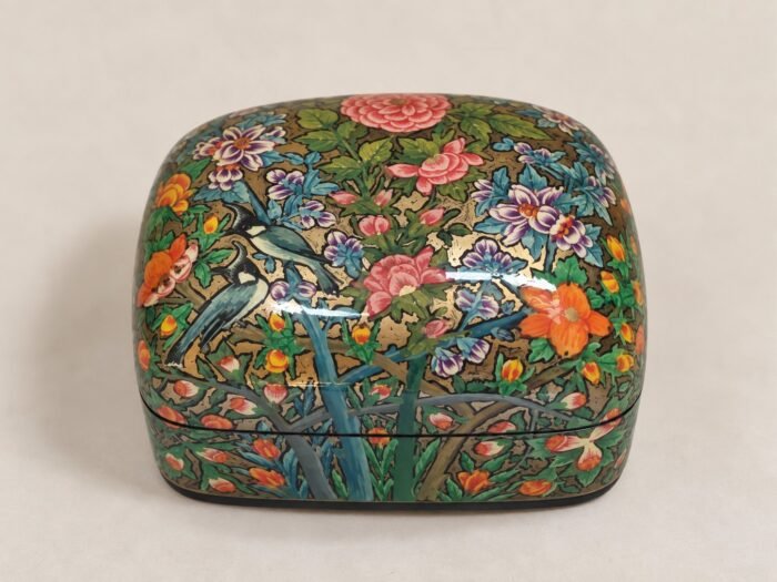 Closed pink rose papier mache box hand-painted with pink and orange flowers and a blue bird on green foliage, small Kashmiri jewelry box