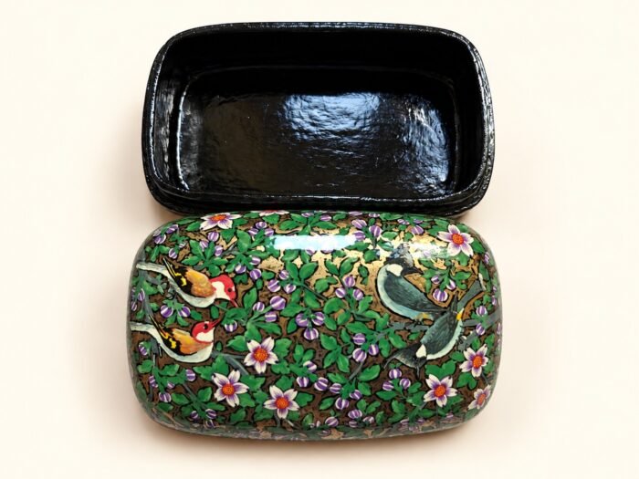 Open 7x4 inch papier mache box hand-painted with red-headed finches and songbirds among white blossoms on green, glossy black lacquered interior
