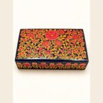Red floral papier mache box hand-painted in Kashmir with a vivid red floral pattern and deep blue border