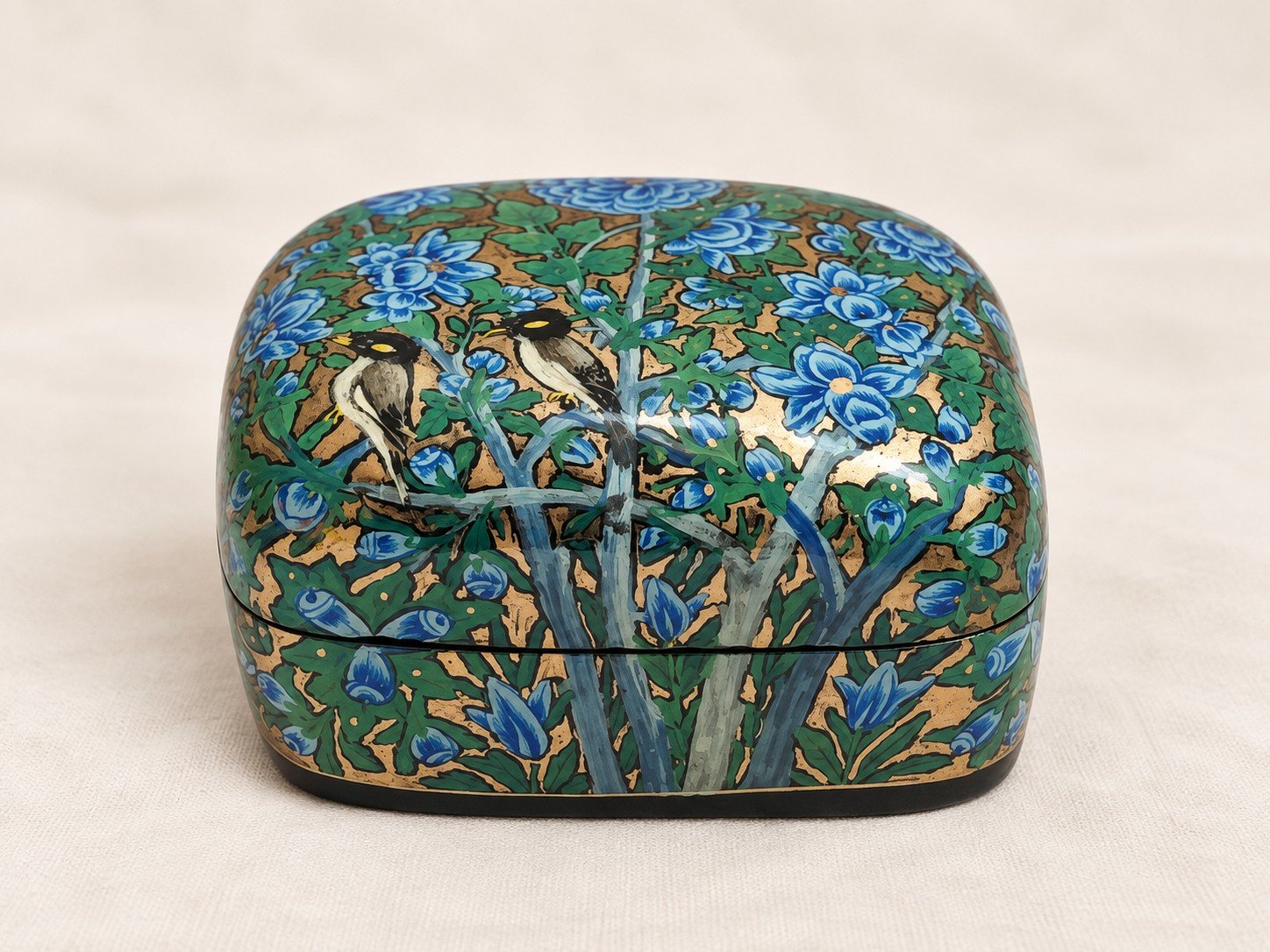 Blue papier mache box hand-painted with a pair of birds among blue flowers and green foliage on gold, small Kashmiri jewelry box