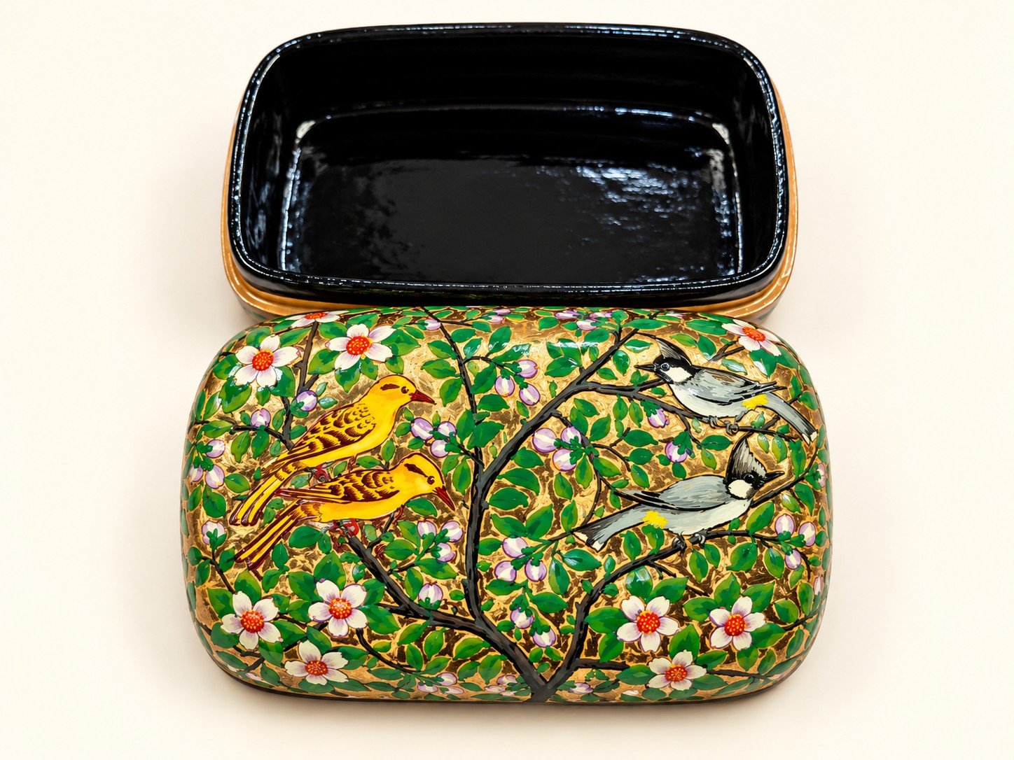 Open 7x4 inch papier mache box hand-painted with golden yellow birds on flowering branches and white blossoms, glossy black lacquered interior